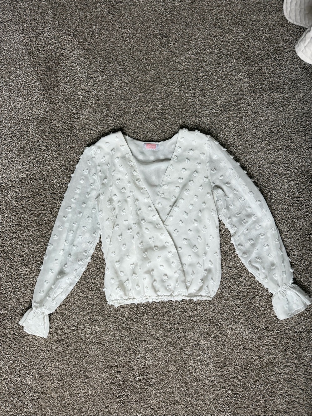 White Textured Wrap-Front Blouse with Ruffle Cuffs